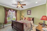 This secondary bedroom has large windows, a walk in closet and en suite bathroom.