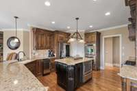 Stainless Steel appliances are the jewelry that make this kitchen sparkle. The complimentary island in the center gives even more prep space.
