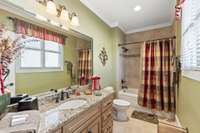 Another private bathroom attached to a secondary main level bedroom.