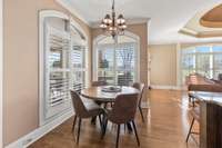 This cozy breakfast nook off of the kitchen has views of the backyard.