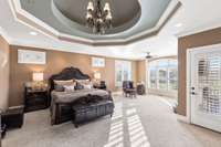 Notice another octagonal dome ceiling with chandelier. The primary bedroom has recessed lighting as well.