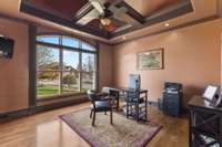 Enter the office through French doors and enjoy the continued attention to detail. The office maintains the hardwood flooring and again brings unique design with floating coffered molding under a vaulted ceiling.