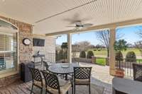 You'll love this covered porch living space with stamped concrete floors.