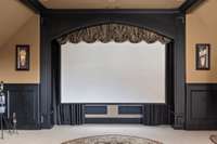 This 125" remote controlled retractable screen is great for movie night. Included is the Epson projector and in-ceiling surround sound speakers.