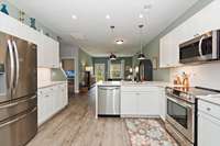 Open Kitchen, Dining, and Den area.