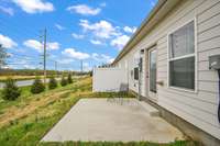 THIS IS A VIEW OF THE BACK OF THE PROPERTY.  IT HAS A FENCE BETWEEN EACH UNIT BUT IT ISN'T ENCLOSED.   IT MIGHT COULD BE ENCLOSED.