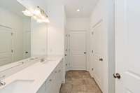 THIS IS THE MASTER BATHROOM WITH DOUBLE SINKS.