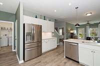 The Utility Room is on the first floor with luxury vinyl flooring too.j