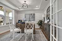 Stock Model Photo. Dedicated Study with included tray ceiling and French Doors!