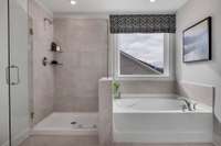 Stock Model Photo. Primary Bathroom with walk-in shower and separate tub or choose an oversized shower at no additional cost!