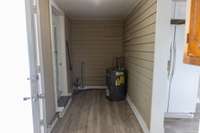 Enclosed utility room can be accessed through the backdoor, the kitchen and bedroom #2.  Washer & Dryer connections - Water Heater