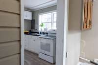 Enclosed Utility Room - can be accessed through the backdoor, the kitchen and bedroom #2.  Washer & Dryer connections & newer water heater (no additional information)