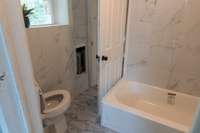 Natural Gas Heat in Full Bath, New Tub/Shower Combo and Wall Surround, New Toilet and Sink with Cabinet