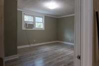 Bedroom #2 with Gas Heat and Extra Window Unit for Additional Comfort - Laminate Flooring and Freshly Painted