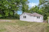 The property goes well beyond the trees in the back per the tax plat.  Be sure to verify all pertinent information. Do not enter the shed, the owner makes no claim for the safety of this structure.