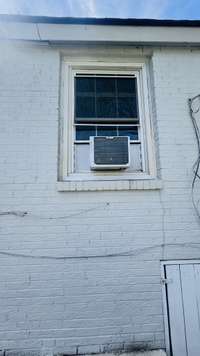 Additional window unit installed in the bedroom on the rear of the house