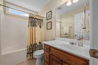 Upstairs features another full bathroom with large vanity and shower/tub combo. Perfect for guests to have a private suite to themselves.