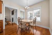 Kitchen has an eat-in area with a great view of the backyard and in-ground pool.