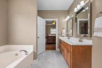 The primary ensuite features double vanities, soaking tub and walk-in shower plus separate toilet area and walk-in closet.