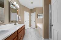 The primary ensuite features double vanities, soaking tub and walk-in shower plus separate toilet area and walk-in closet.