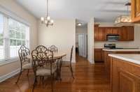 Kitchen has an eat-in area with a great view of the backyard and in-ground pool.