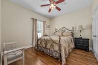 One of the three bedrooms on the main level. This one overlooks backyard and pool. All flooring on main level is either hardwood or tile.