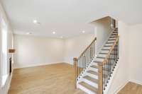 Oak tread stairs with iron spindles for that polished touch!