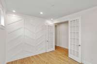 Spacious office with chevron accent wall.