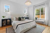 First Floor Primary with en suite, walk in closet and access to back porch.