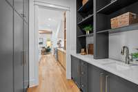 This is the wet bar located between the kitchen and formal living room. Provides tons of storage and a mini fridge.