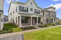 Modern Farmhouse Elevation with Full Front Porch. Photo is of actual Home.