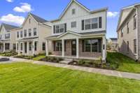 Modern Farmhouse Elevation with Full Front Porch. Photo is of actual Home.