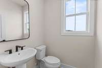 First floor powder room *Photos are for representational purposes only and are of a similar floor plan with differing finishes*