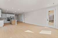 Great room with access to the covered patio *Photos are for representational purposes only and are of a similar floor plan with differing finishes*