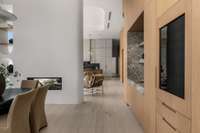 Dining space sets in front of wet bar