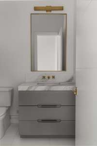 Modern vanity with beautiful gold fixtures