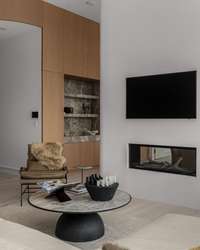 Beautiful plaster double-sided fireplace in living area