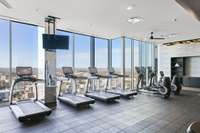 Cardio equipment overlooking city