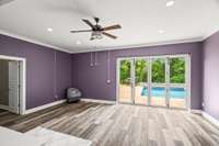 Downstairs kitchen/living room combo, entrance to the pool