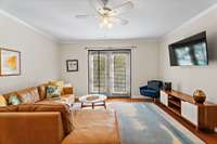 Living Room opens to private back patio overlooking a peaceful stream!