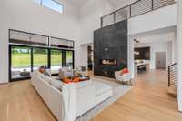 Great Room with 23'5" ceiling height.  Loft area at the top of the stairs.
