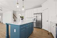 Large kitchen island is great for entertaining, feeding the kids on the fly or a great work space for baking.