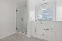 Separate shower and tub. Walk-in jacuzzi tub, ideal for an elderly parent, but honestly, it's a really nice tub. Original tub can be re-installed. It's in the garage.