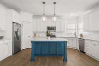 This kitchen offers so much cabinet and counter space!