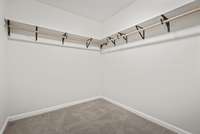 Walk in closet in primary bathroom