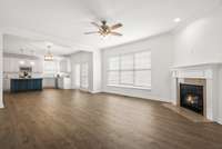 Living room is open to kitchen. Many windows and great natural light