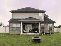 Covered back porch with fenced back yard