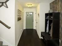 Entryway and door to guest 1/2 bath