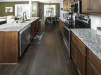 Kitchen has stainless steel appliances, granite counter tops and solid wood cabinets
