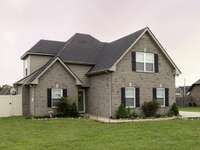 4 bedroom, 2 1/2 baths, fenced back yard, 2 car side attached garage
